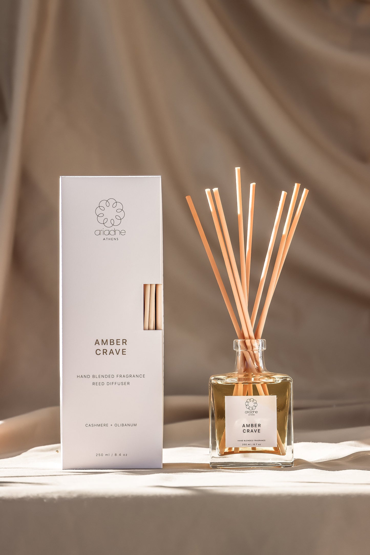 Amber Crave Reed Diffuser, the sticks and the packaging.