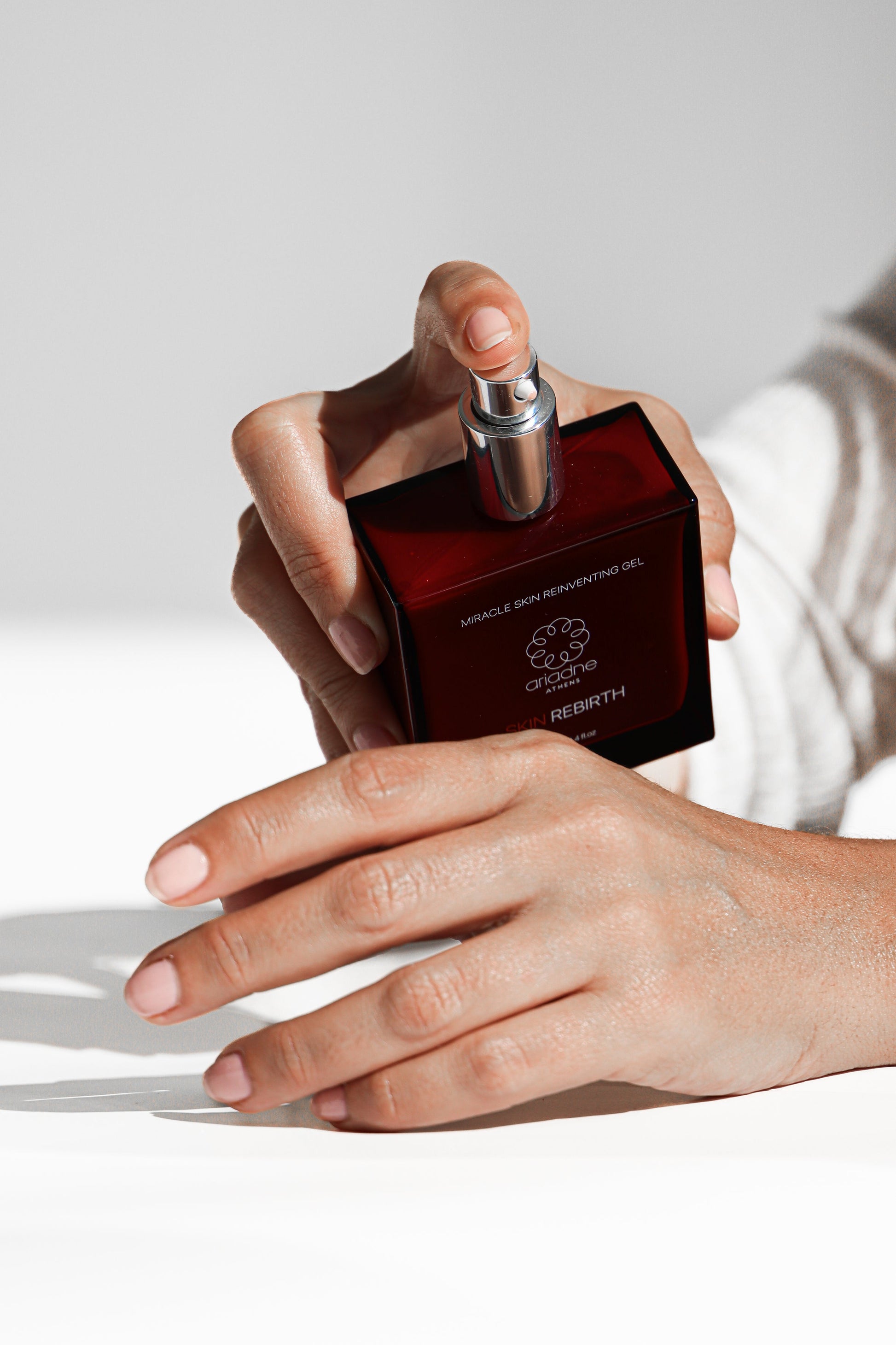 A woman using the Skin Rebirth - Miracle Skin Reinventing Gel in use.